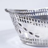 An Edwardian silver oval bon bon basket, with pierced border and gadrooned edge, by Matthew John