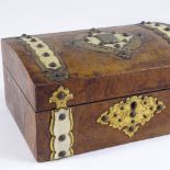 A Victorian walnut dome-top jewel box, with ivory and brass mounts, and tray-fitted interior,