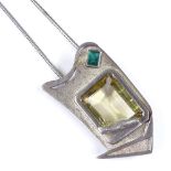 A 1960 sterling silver emerald and citrine geometric pendant necklace, on silver snake link chain,
