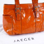 A Jaeger orange patent leather handbag, with dust bag