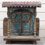 A small Indian carved and painted wood 2-door shrine cover, with turned columns, width 70cm, height