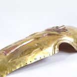 A Middle Eastern gilded copper horse armour face cover, length 56cm