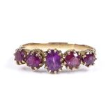 An unmarked gold 5-stone amethyst ring, setting height 6.7mm, size T, 3g