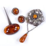An Art Nouveau silver and amber brooch, together with a silver and amber pendant and earring set (3)