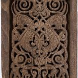 An Islamic relief carved wood panel, with interwoven horse design, 32cm x 22cm