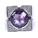 A large Versace 18ct white gold amethyst and diamond dress ring, with faceted domed amethyst and