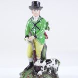 A 19th century Staffordshire pearlware figure of a gamekeeper and hound, height 18cm
