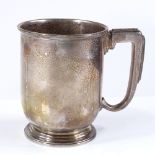 A George VI silver pint mug, of plain cylindrical form, by William Neale Ltd, hallmarks Birmingham