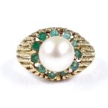 A Middle Eastern 18ct gold whole pearl and emerald cluster ring, with openwork rope twist bridge,