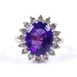 An 18ct gold amethyst and diamond cluster ring, setting height 17.2mm, size O, 6.5g