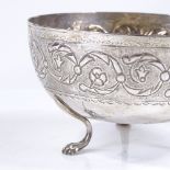 A Continental silver circular bowl, with relief embossed decoration, on paw feet, diameter 12cm, 4oz