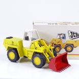 A boxed West German 1;35 scale diecast model JCB418 articulated loader by NZG