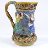 A 19th century Minton Majolica pottery jug, with relief decorated figures around tower, height 24cm
