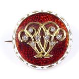 An Antique unmarked gold red and white enamel and diamond circular brooch, with crystal photo