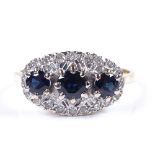 An 18ct gold sapphire and diamond cluster dress ring, setting height 10.6mm, size T, 5.4g