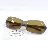 Prada new lady's sunglasses, with grey/beige opaque frames