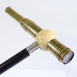 A rare ivory and brass telescope-handled walking cane, the ivory ball top enclosing a brass 2-draw
