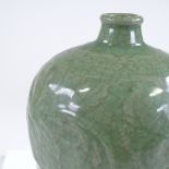 A Chinese celadon crackle glazed bottle vase, with relief floral decoration, height 29cm