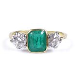 An 18ct gold 3-stone emerald and diamond ring, circa 1910, setting height 7.9mm, size N, 2.8g