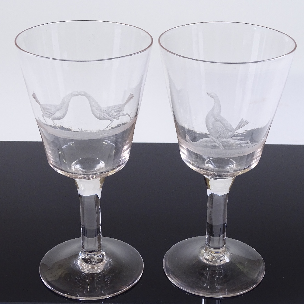 A pair of 19th century funnel-shaped wine glasses, with wheel-cut fighting cock designs, height - Image 2 of 3