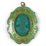 An Antique relief carved green glass cameo pendant, in green enamel and pinchbeck frame, height 44.