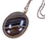 A Victorian banded agate and unmarked gold memorial pendant necklace, with elaborate hair panel