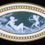 A Limoges pate sur pate porcelain oval dish, with Classical decorated panel in gilded and jewelled