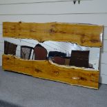 A large natural polished yew wood framed river style wall mirror, approx 2m x 1m