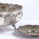 A Continental circular silver fruit bowl, with relief embossed floral decoration, diameter 15cm,