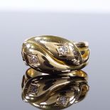 An 18ct gold double snake head ring, set with diamonds, setting height 11mm, size M, 7.8g
