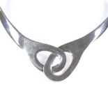 A Mexican sterling silver torque collar necklace, of interlocked design, largest internal width