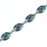 A Celtic sterling silver and enamel panel bracelet, length 20cm, 14.9g