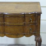 A walnut 2-drawer side table of small size, with shaped front and shell carved cabriole legs,