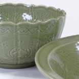 2 similar Chinese green glazed porcelain bowls, with incised decoration, diameter 43cm and 29cm (2)