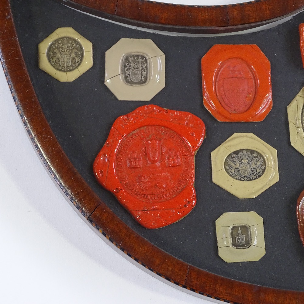 A 19th century banded mahogany shield-shaped frame containing wax seals, width 41cm - Image 3 of 3