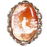 A large 19th century relief carved oval cameo brooch, depicting a young female archer and dog, in