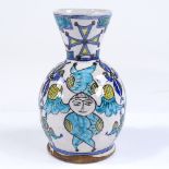 A Turkish faience pottery vase with painted figures, height 15cm