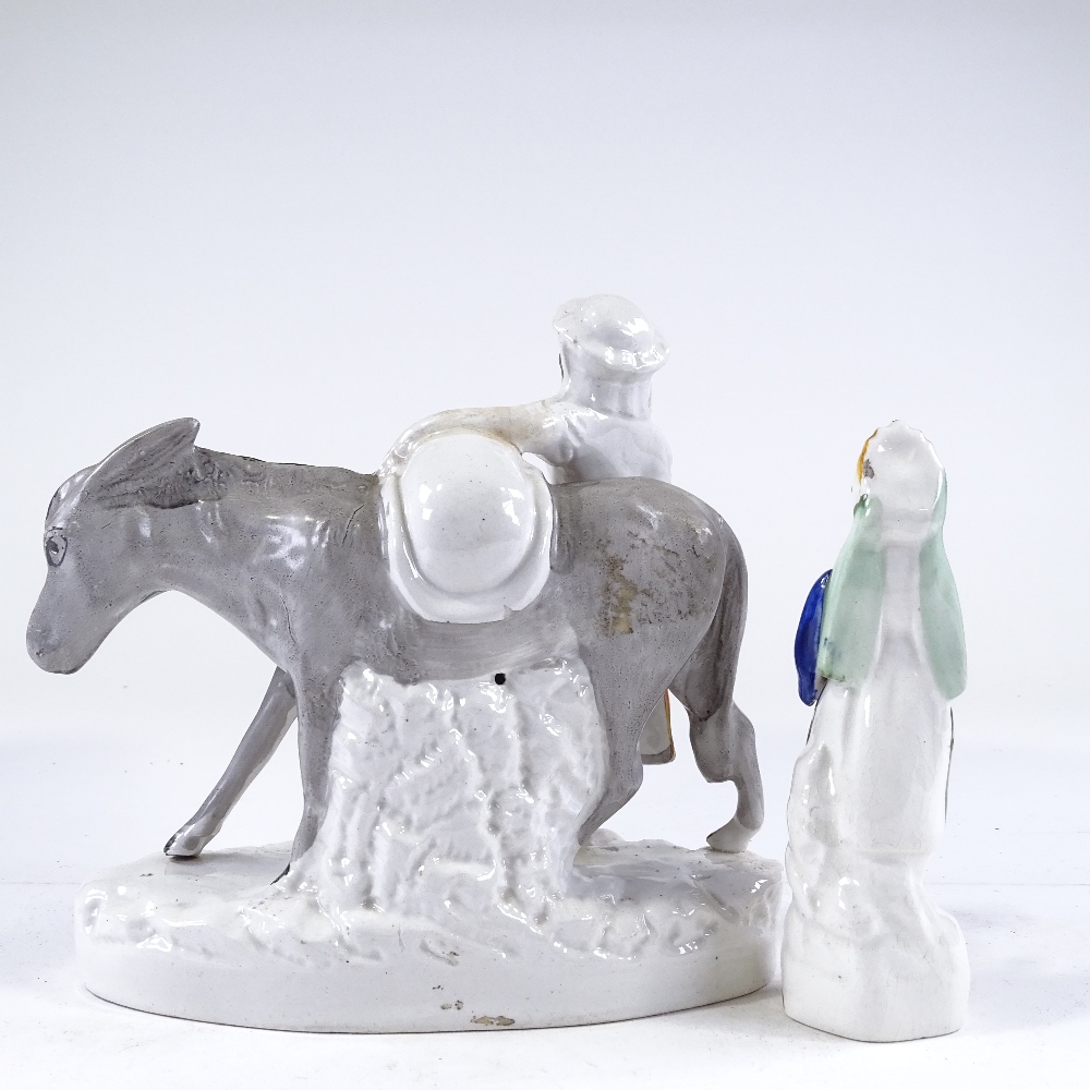 A Victorian Staffordshire girl with a donkey, height 20cm, and a Staffordshire Turkish figure (2) - Image 2 of 3