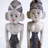 A pair of Indian carved and painted mangrove root figures, height 47cm
