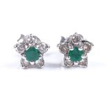 A pair of 18ct white gold emerald and diamond daisy earrings, setting height 6.8mm, 1.8g