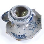 An Italian blue and white pottery faience inkwell, width 15cm