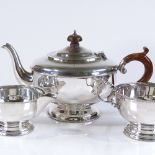 An Art Deco 3-piece silver tea set, of plain circular form with turned wood handles, by Harford Case