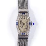 A lady's Art Deco cocktail wristwatch, unmarked white metal case, with sapphire and diamond set