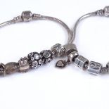2 silver Pandora charm bracelets, with 14 silver charms