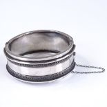 A Victorian sterling silver wide hinged bangle, band width 24.8mm, internal diameter 53mm,