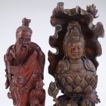 A Chinese carved stained wood Buddha, height 40cm, and a Chinese carved wood fisherman (2)