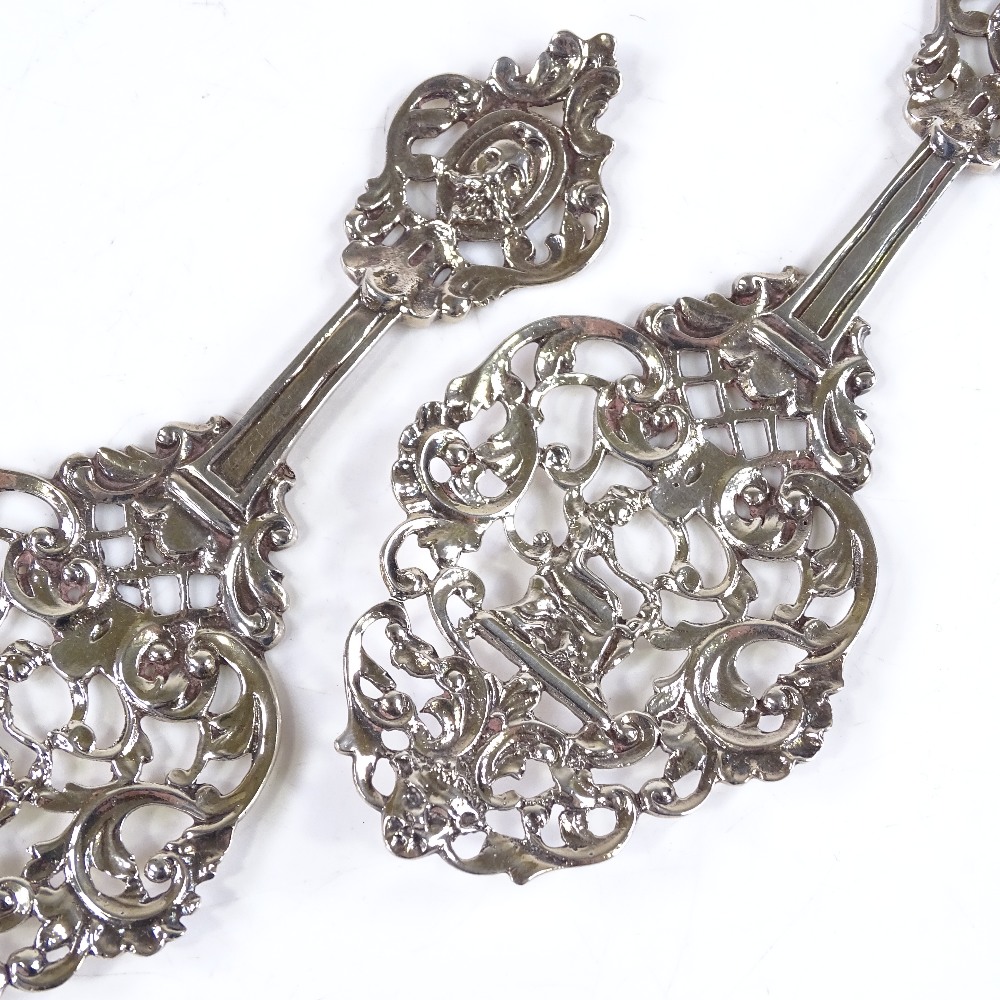 A pair of Edwardian pierced silver spoons, by James Dixon & Sons, hallmarks Sheffield 1906/7, length