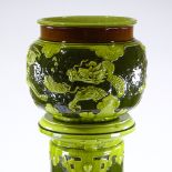 A Bretby Art Pottery 2-tone green glaze jardiniere on pedestal, with Chinese dragon relief designs