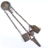 A Victorian nickel plate sewing chatelaine with relief cat design panel