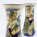 A pair of Moorcroft Pottery floral decorated vases, 1999, height 21cm